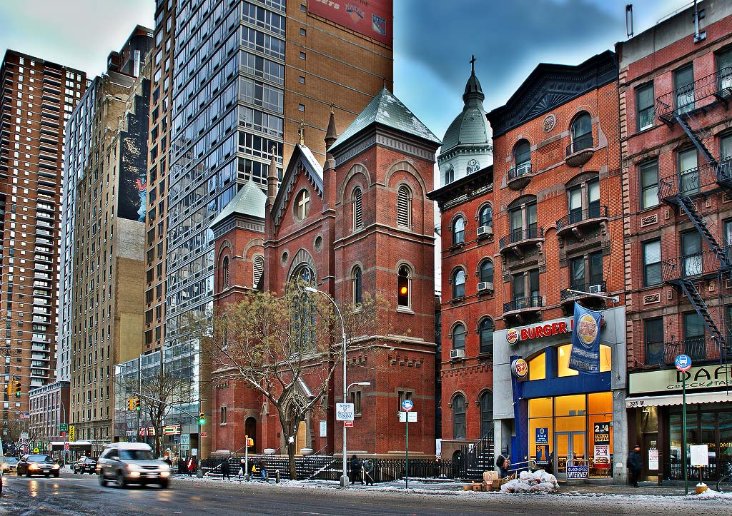 #1. The Church of the Holy Cross is lined up with high rises on West 42nd Street.