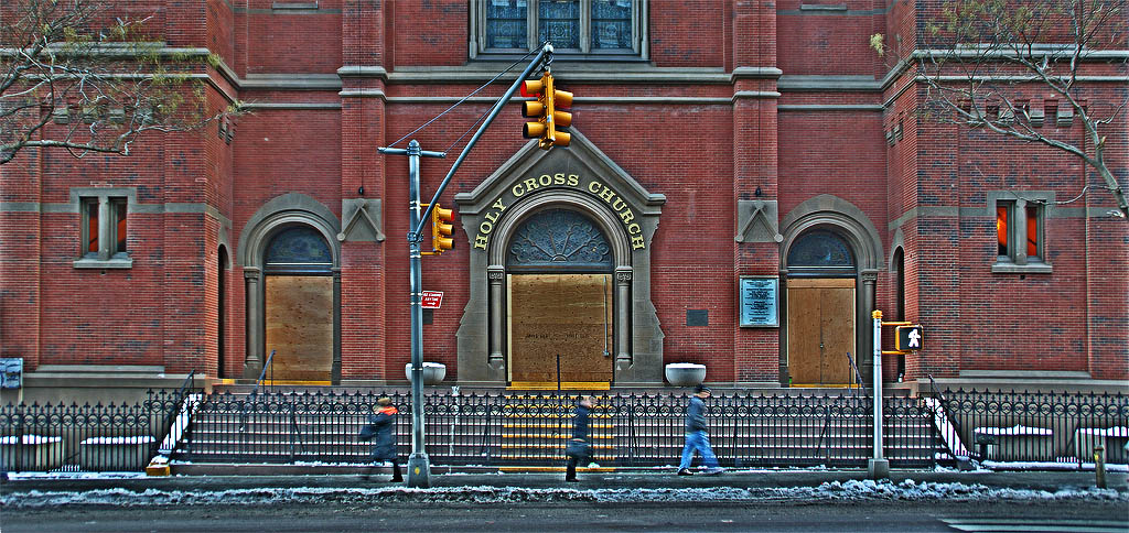 #2. The front doors are boarded up.